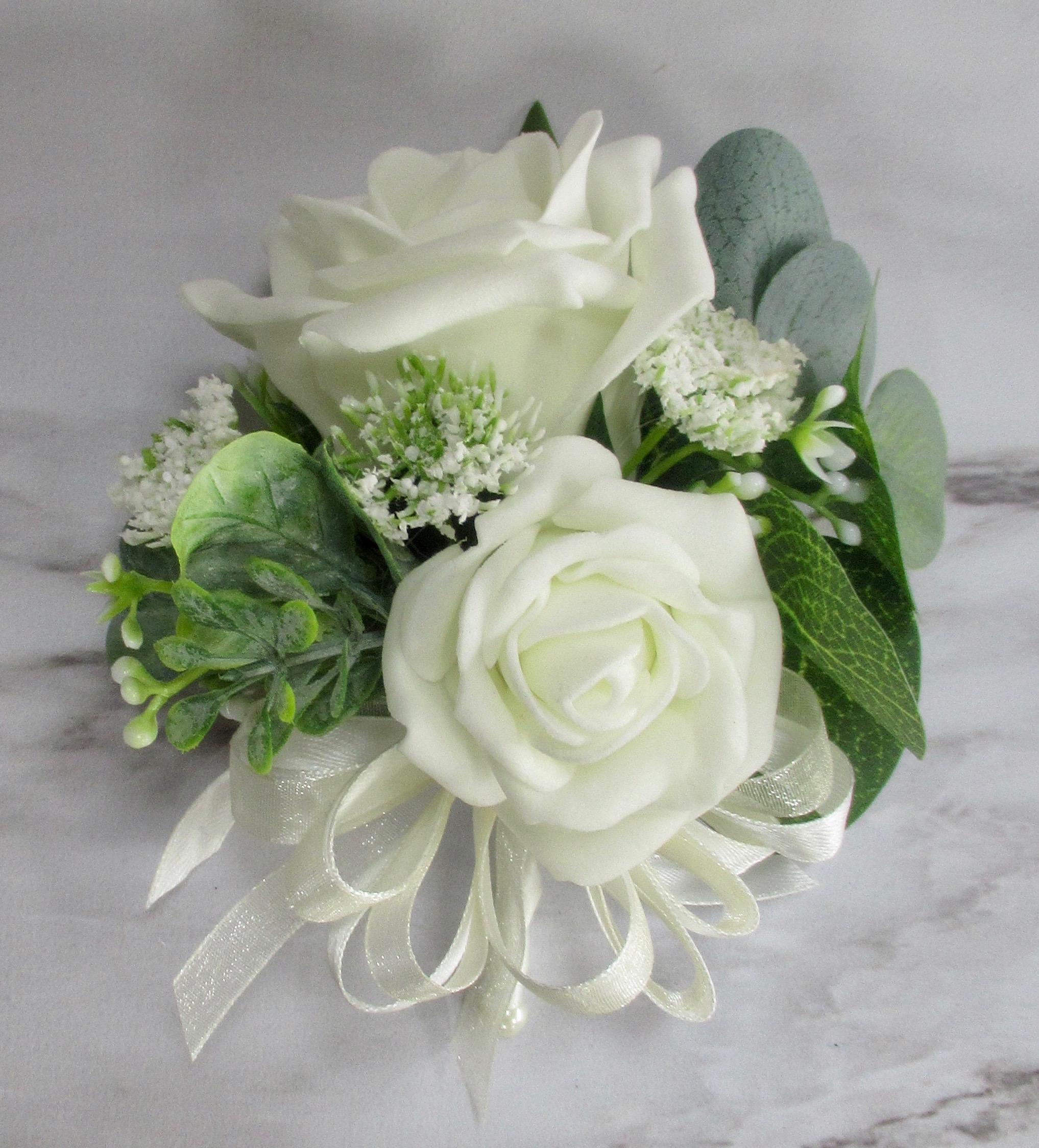Ivory rose and eucalyptus corsage for weddings